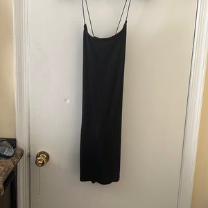 Black dress. Medium. Never worn. Crisscross back.